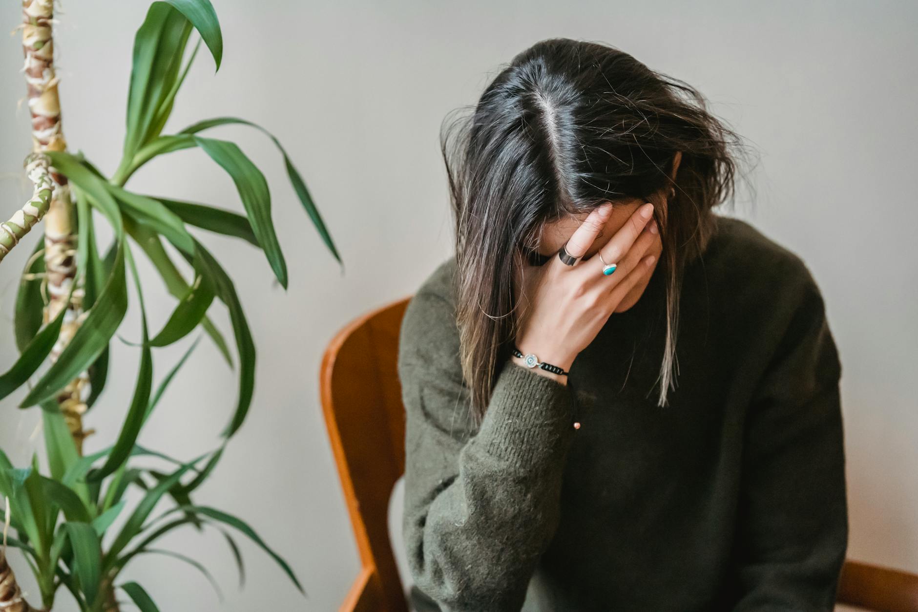 worried young woman dealing with mom guilt