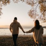 a couple walking on the beach