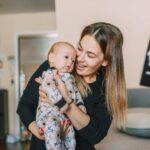 adorable baby looking at the baby flash card